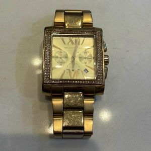 Gold Michael Kors watch with crystal face detail